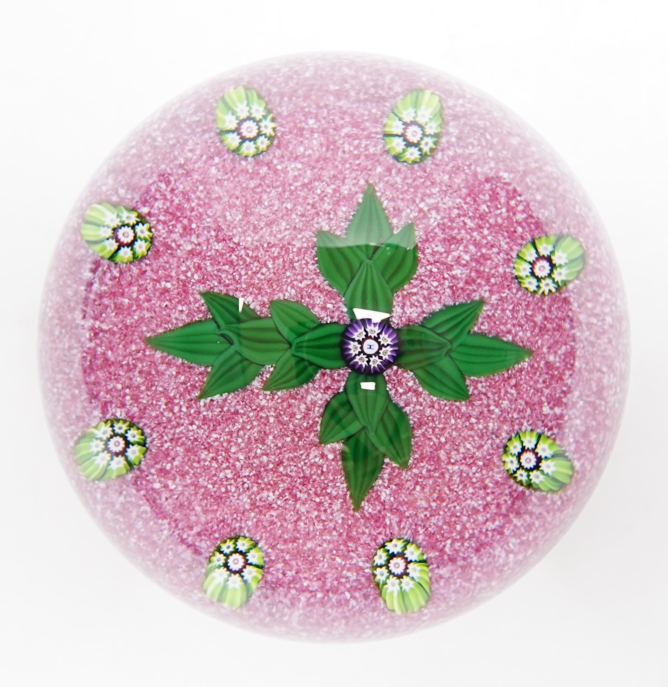 A Paul Ysart ‘leaf cross’ glass paperweight, Harland period, ‘H’ cane, pink jasper ground, polished concave base, paper label to base, 7cm